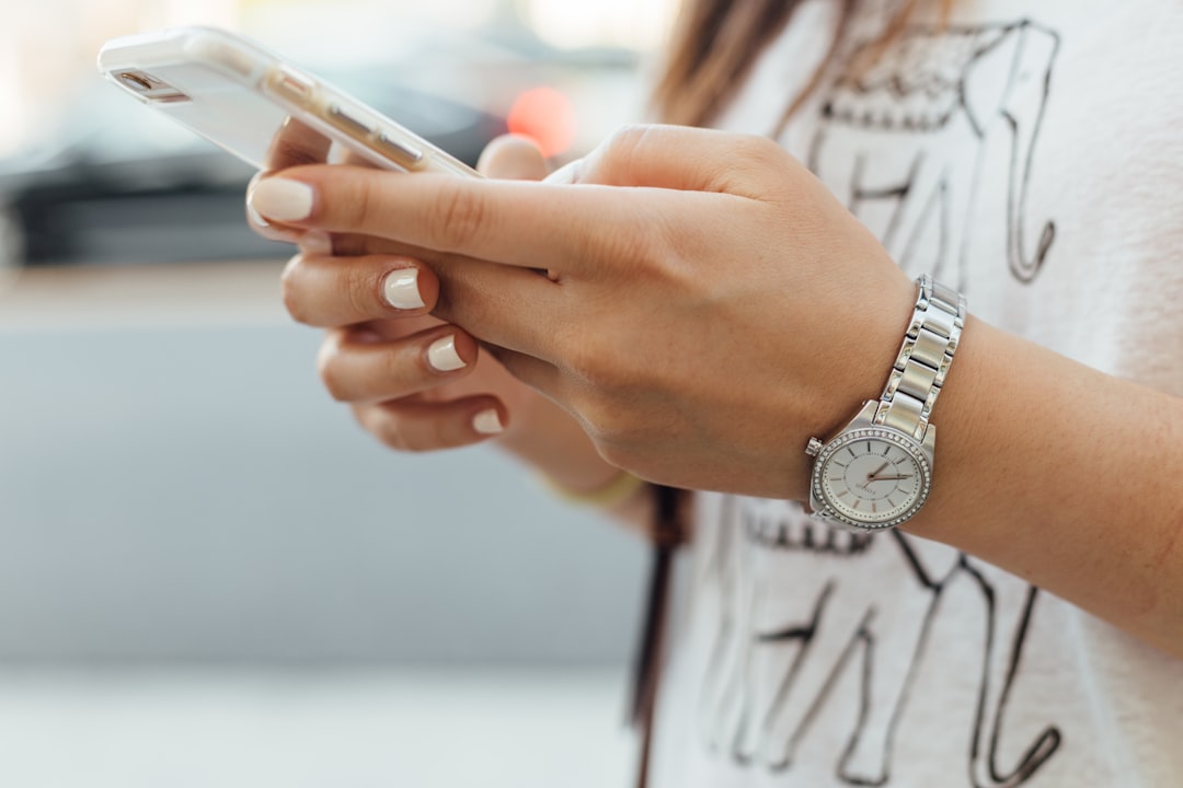 woman-holding-iphone-during-daytime-hbyyffokvm0